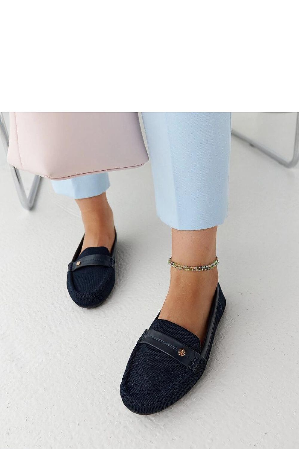 Chic Solea loafers in beige, showcasing the trendy almond toe feature and perfect for warm weather outfits.