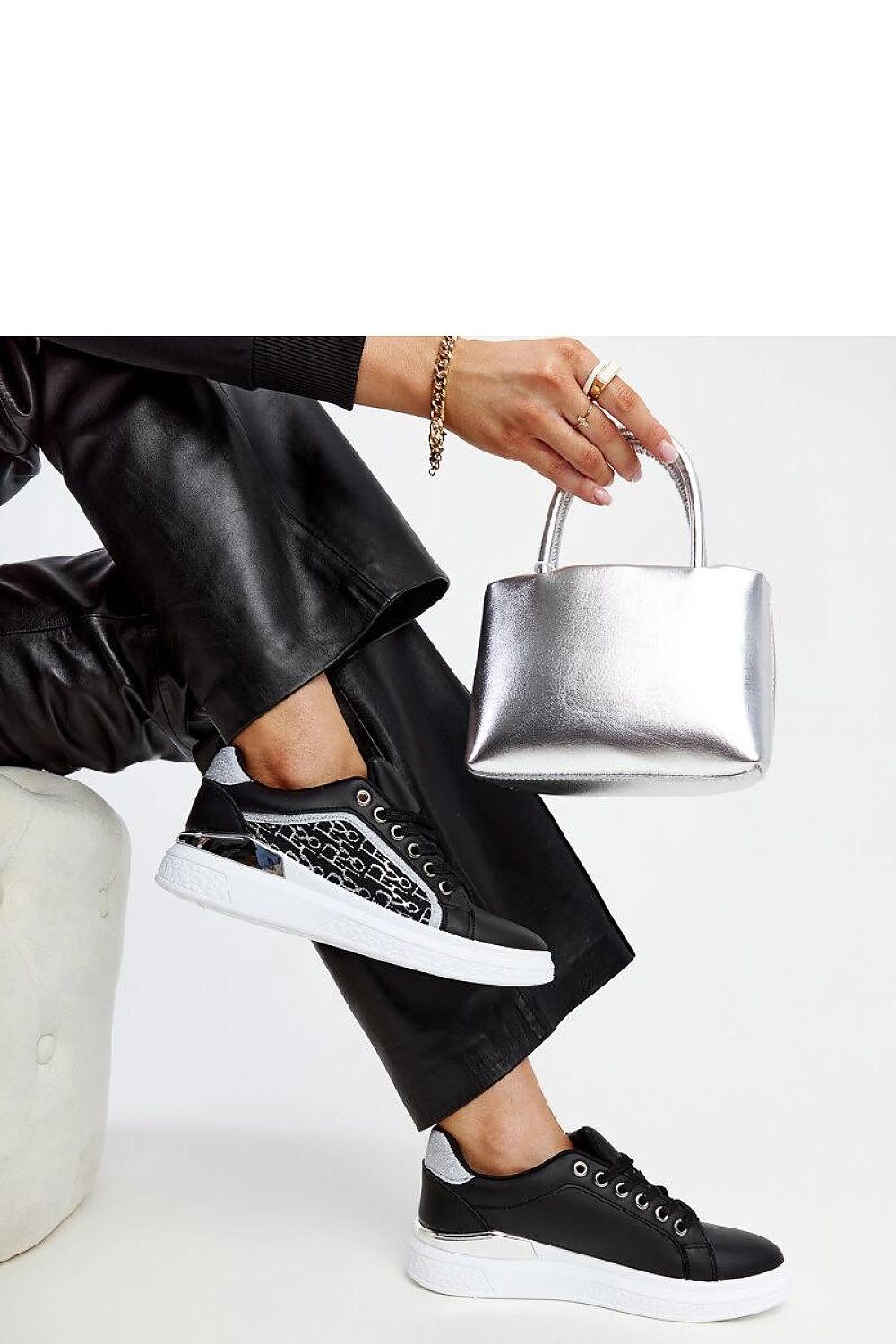 Elegant lace-up black platform sneakers from Solea, adorned with sparkling glitter, ideal for adding glamour to your casual attire.