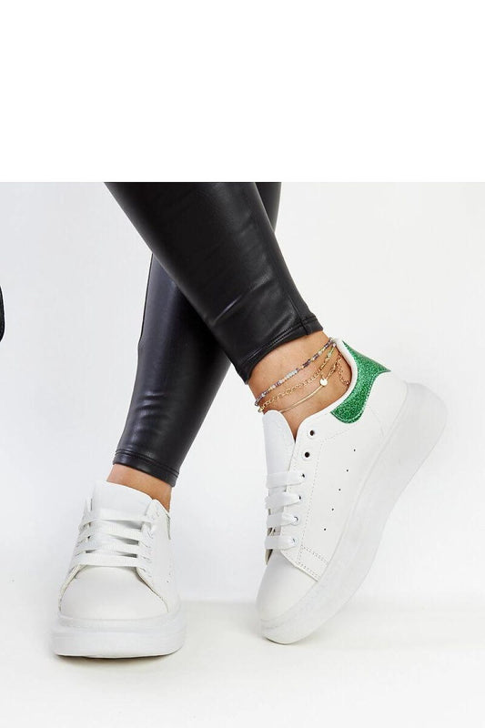 Detail of Solea eco-leather sneakers, showcasing high-quality craftsmanship and stylish design in white and green for women's fashion.