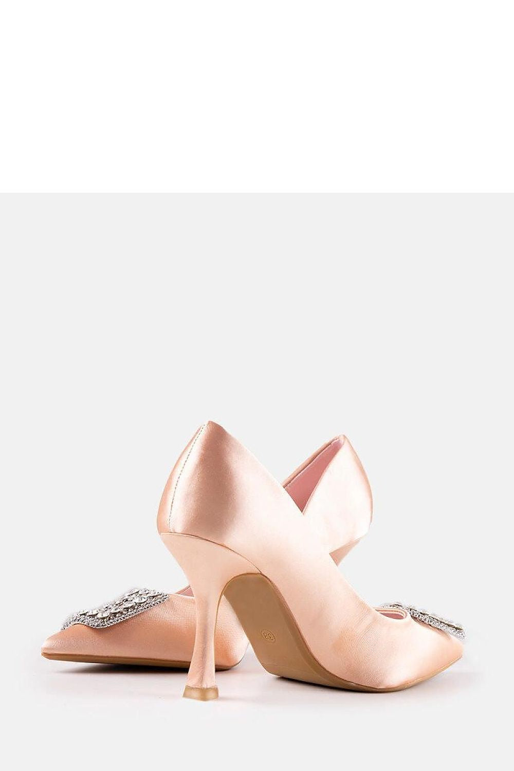 Close-up of Solea's stylish beige satin pumps with pointed toe and rhinestones, perfect for adding sophistication to summer outfits.