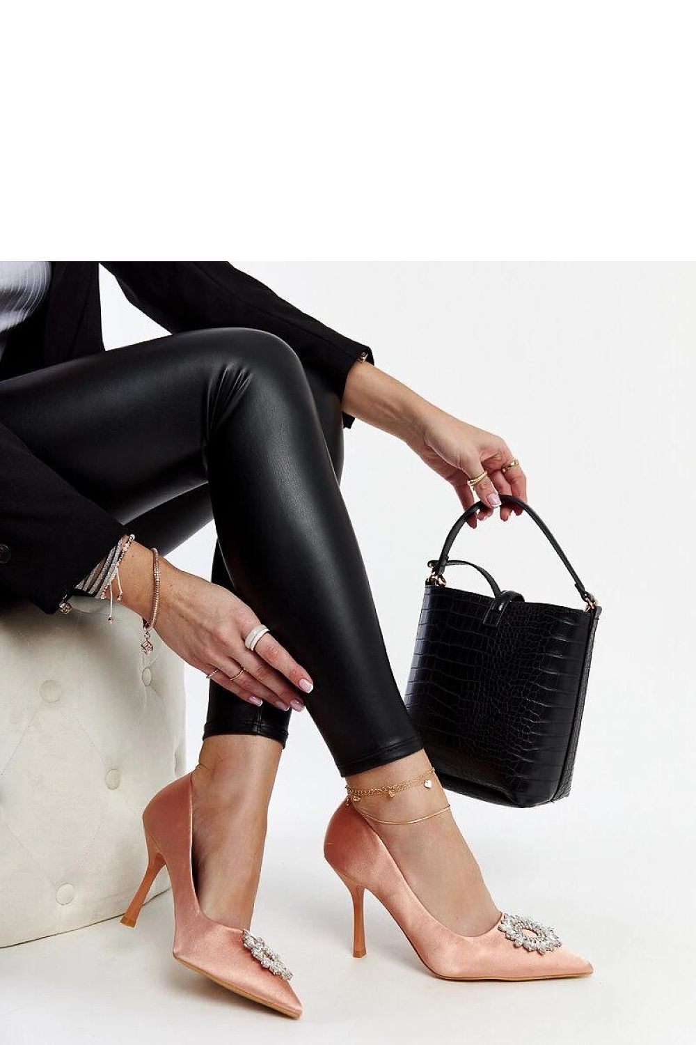 Elevated view of Solea's high heel Susegana pumps in vibrant green satin adorned with zircon embellishments for a sophisticated summer look.