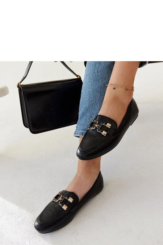 Close-up of Solea's black moccasin loafers featuring a stylish buckle detail, crafted from durable eco leather for fashionable summer wear.