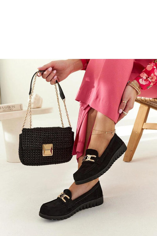 Minimalist design of Solea black suede moccasins featuring a round toe and eco-leather material, perfect for everyday luxury wear.