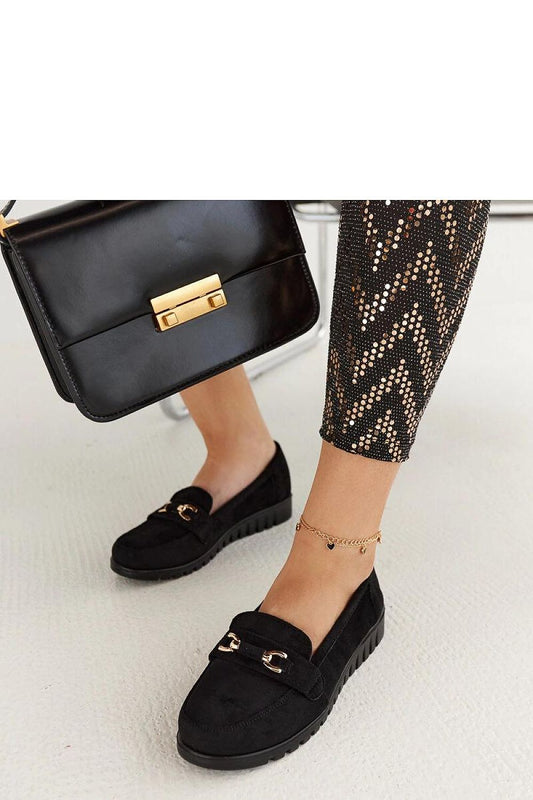 Luxury black suede moccasins for women from Solea, featuring a stylish slip-on design, perfect for spring and summer attire. Available in EU sizes 36-41 and US sizes 5.5-10.5, embodying elegance and comfort.