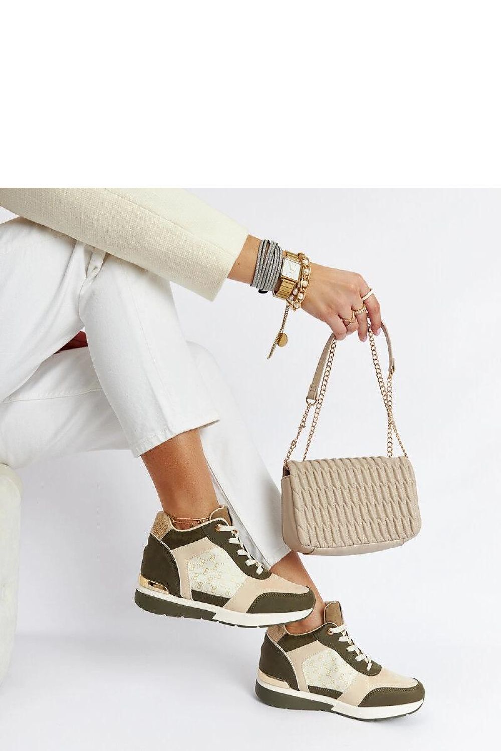 Lifestyle image of Solea Black Eco-Leather Wedge Sneakers being worn outdoors, showcasing comfort and style for summer wear.