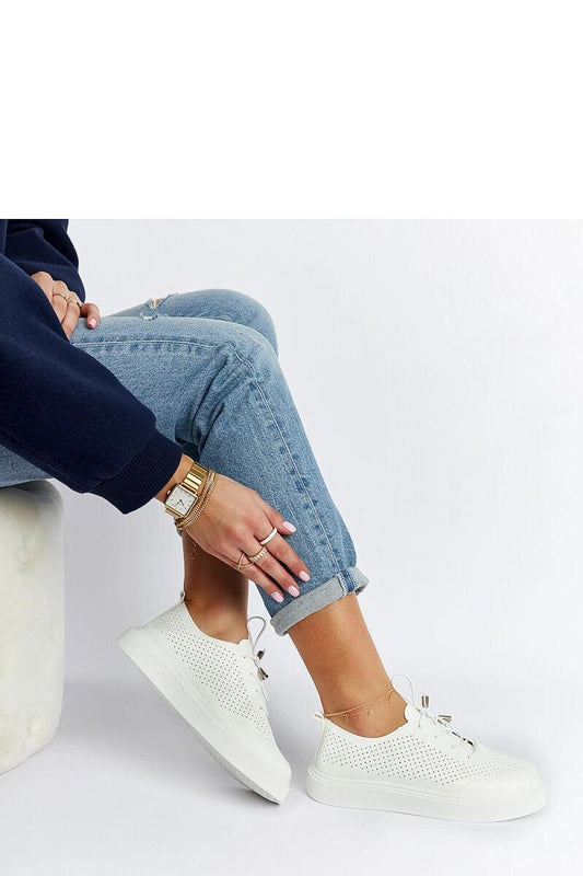 Close-up of Solea Luxury White Eco-Leather Sneakers, highlighting intricate perforations and comfortable white rubber sole, perfect for summer elegance.