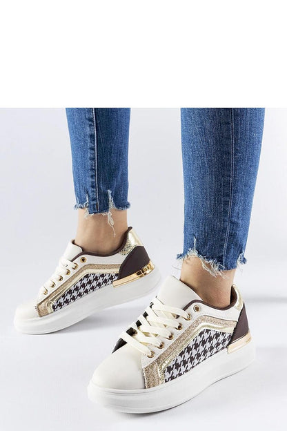 Lifestyle image featuring Solea Briercliff Elegant Beige Glitter Sneakers, illustrating their versatility and chic style in a fashionable casual setting.