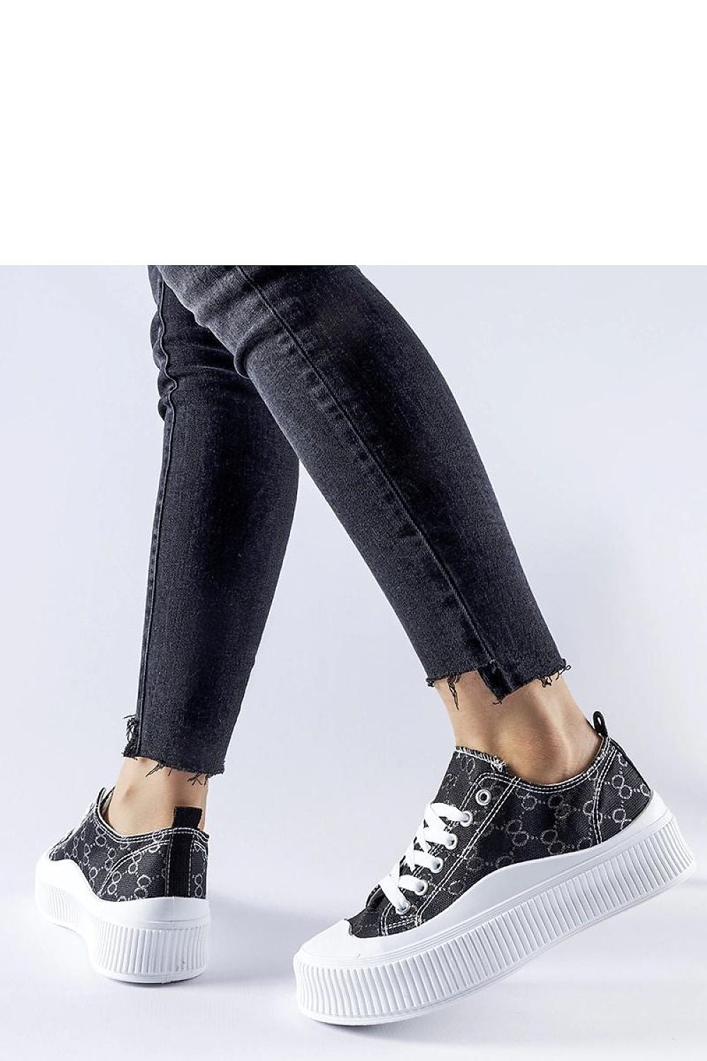 Solea Brown Sneakers paired with summer attire, accentuating their chic and fashionable appeal for warm weather.