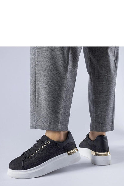 Chic display of Solea black platform sneakers Scuderlando, showcasing their contemporary sporty style and comfortable fabric for warm weather.