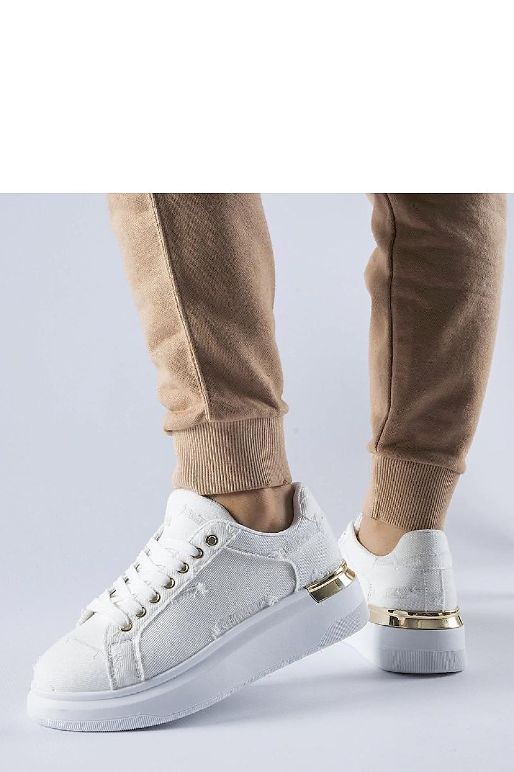 Elegant Solea high-quality white platform sneakers, showcasing a stylish lace-up closure perfect for warm, summer days.