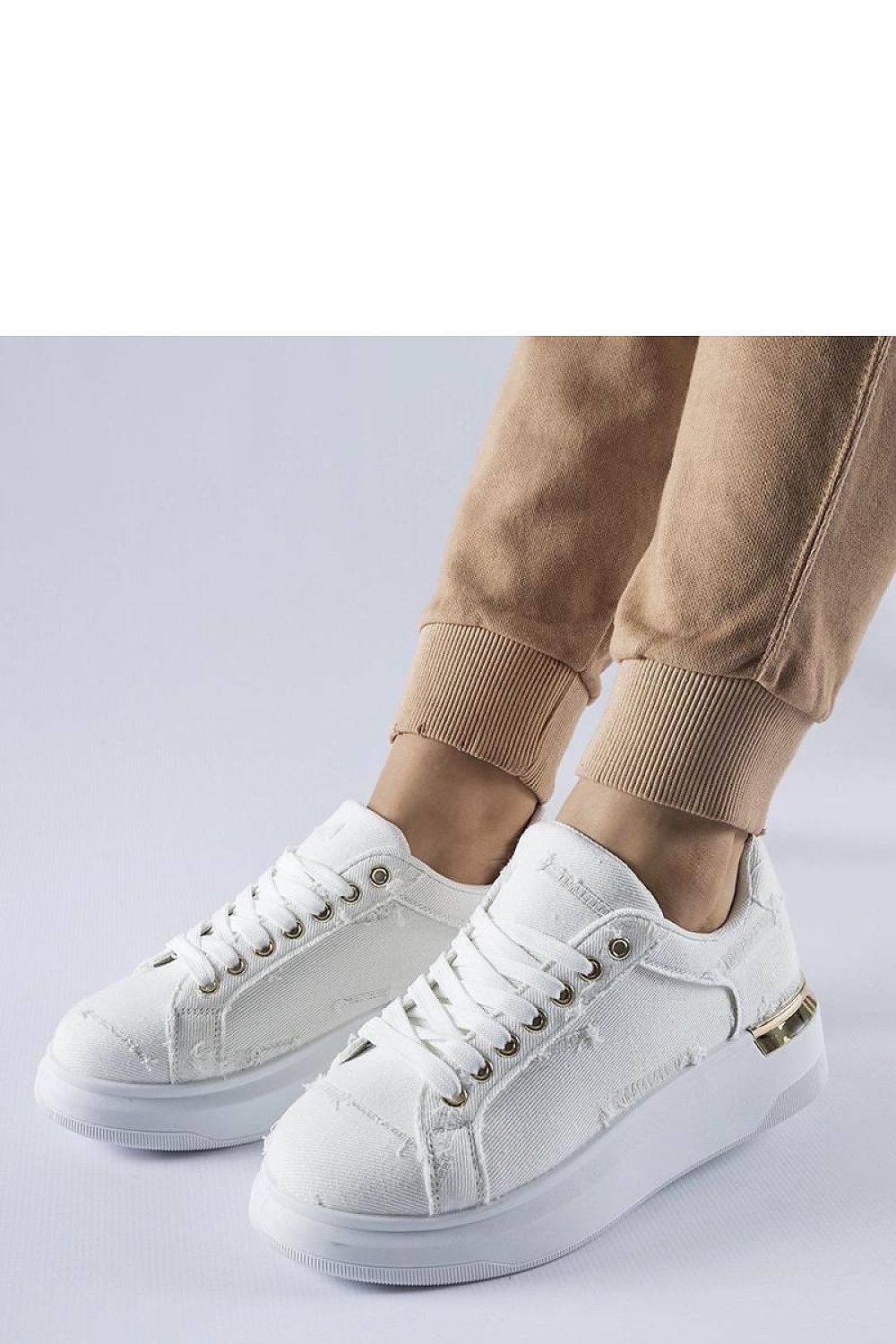 Chic Solea white platform sneakers, offering a contemporary look with a 5 cm heel, ideal for adding comfort and sophistication to your summer wardrobe.