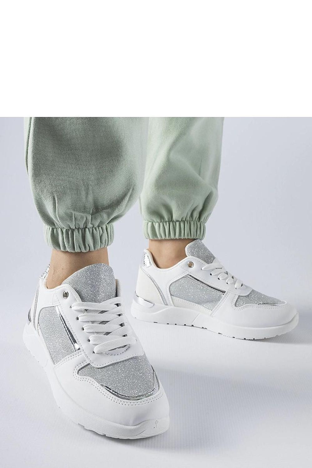 Luxury white sneakers designed by Solea, featuring decorative stitching and a lace-up closure for a perfect fit, ideal for spring and summer wear.