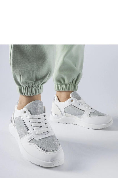 Luxury white sneakers designed by Solea, featuring decorative stitching and a lace-up closure for a perfect fit, ideal for spring and summer wear.