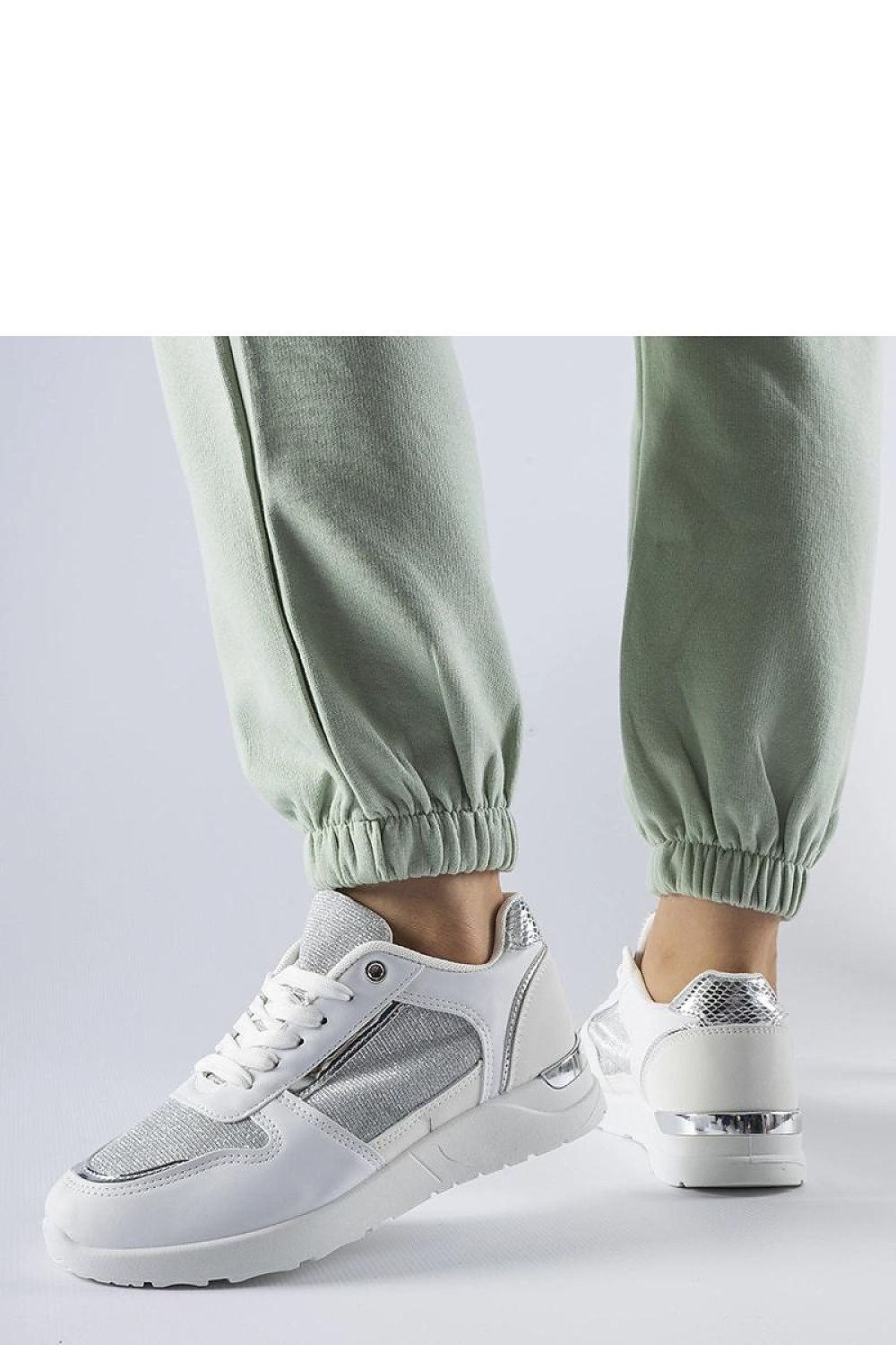 Stylish white Solea sneakers for women, perfect for spring and summer, featuring a durable rubber sole and comfortable fit.