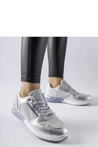 Fashionable Solea white sneakers on a stylish background, ideal for casual wear during warm seasons.