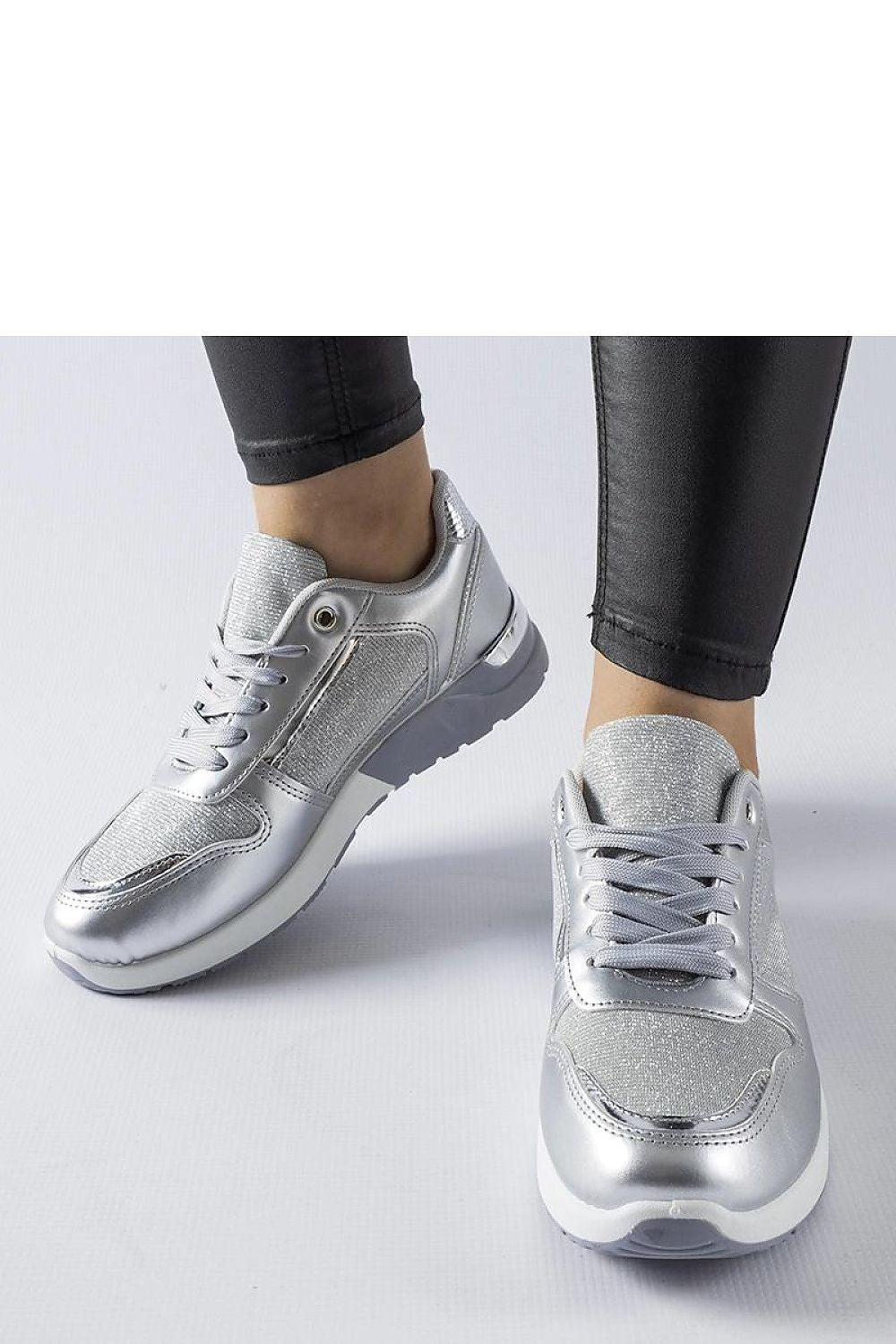 Solea luxury white sneakers displayed with detailed view of the lace-up design, perfect for enhancing everyday outfits.