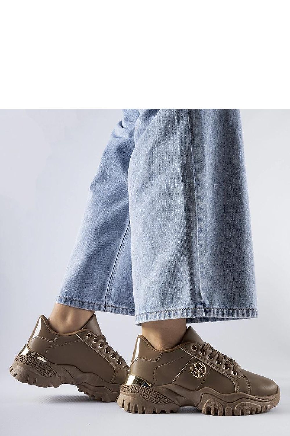 Close-up of Solea eco leather brown sneakers with chunky sole, ideal for sporty spring-summer outfits.