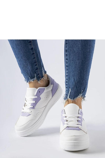 Close-up of Solea's luxurious white sneakers with purple detailing, crafted from eco-friendly synthetic suede leather.