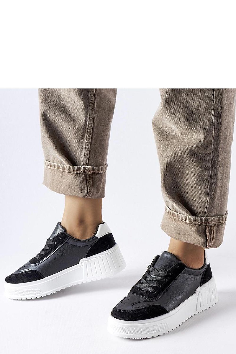 Stylish Solea Black Eco Leather Sneakers showcasing a chic design on a 5cm thick platform, ideal for enhancing any outfit.