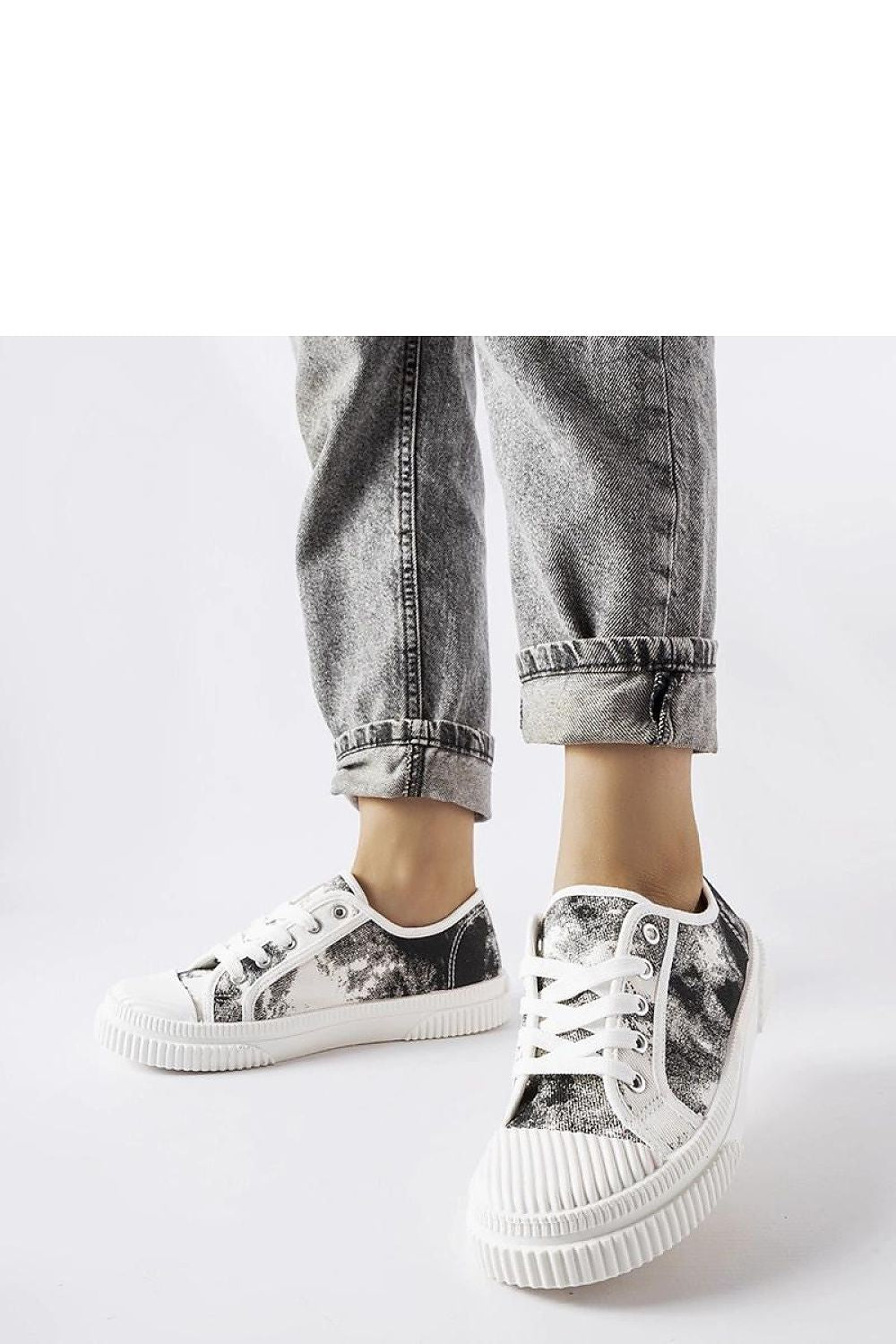 Showcasing Clavet women's blue sneakers with a fading effect, emphasizing their combination of comfort, style, and functionality for the luxury-conscious.