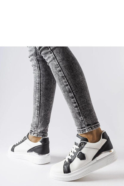 Close-up of the Solea White Via Sneakers highlighting the exquisite silver detailing on eco leather, perfect for fashion-forward individuals.