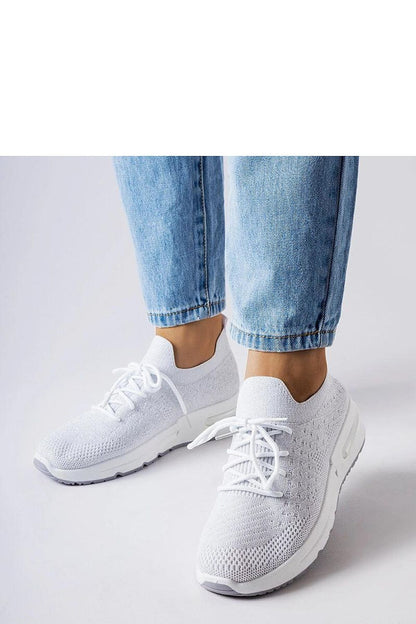Chic and comfortable Solea women's slip-on sneakers in pristine white with sophisticated silver thread embellishments, ideal summer footwear.