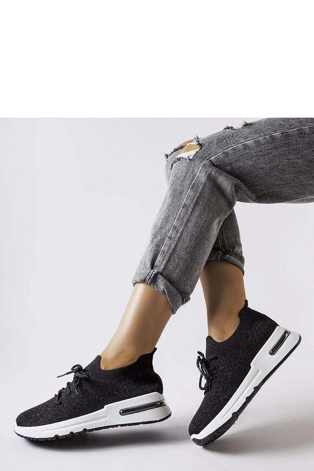 Close-up of Solea Women's White Sneakers featuring a slip-on design, crafted for stylish summer wear with silver thread accents.