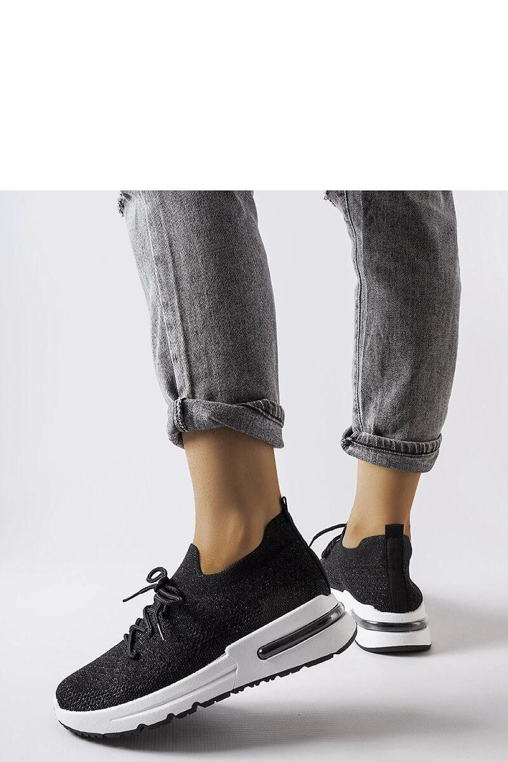 Side view of Solea slip-on white sneakers with a contemporary silhouette and silver thread, designed for luxury summer footwear.