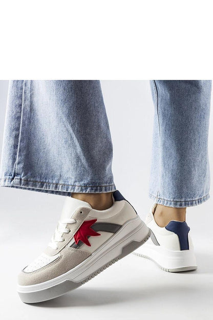 Stylish white sneakers from Solea displayed against a minimalist background, highlighting their versatility for summer outfits.