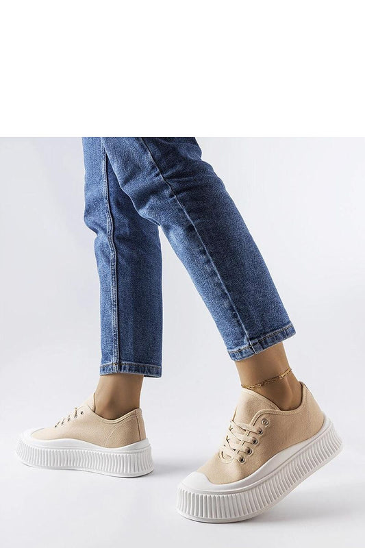 Close-up of elegant beige lace-up platform sneakers by Solea, made with high-quality fabric and a white rubber sole for comfort.