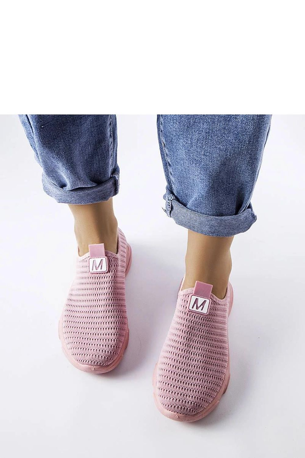 Luxury design of Solea Pink Slip-On Sports Shoes showcasing durable fabric and fashionable slip-on closure, tailored for active women, ideal for warm weather.