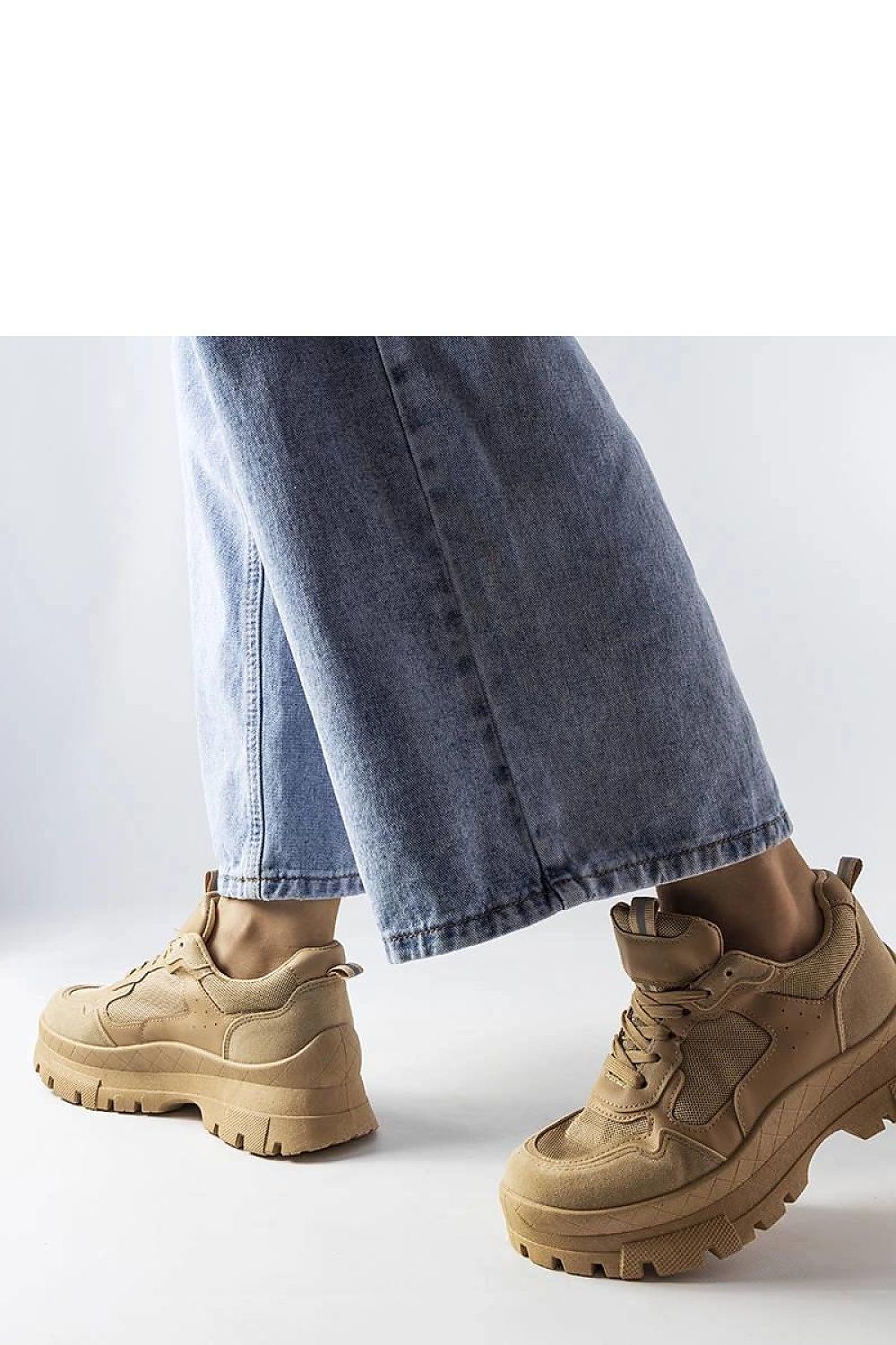 Close-up view of Solea's luxury dark beige sneakers, showcasing high-quality materials and classic lace-up style perfect for summer activities.