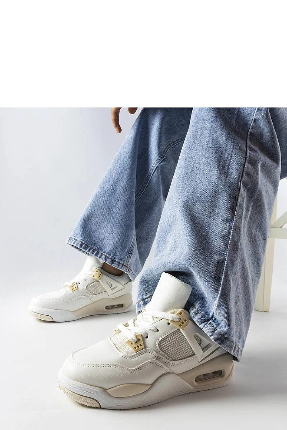 Close-up view of Solea's luxury beige Malas sneakers, featuring a comfortable low upper and stylish white rubber sole.