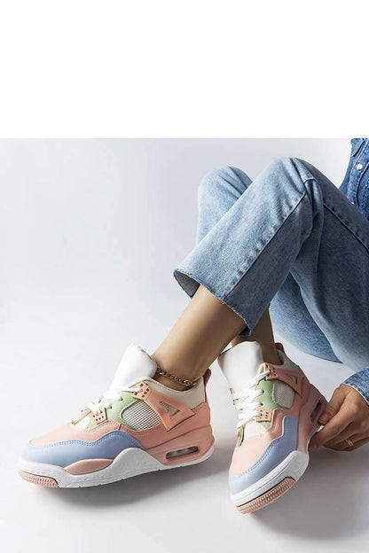 Solea luxury beige Malas sneakers standing on a surface, highlighting their chic design and versatile appeal.