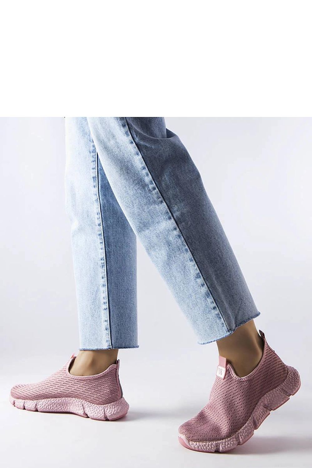 Close-up of Solea women's pink slip-on sneakers featuring durable high-quality rubber material for fashionable comfort.