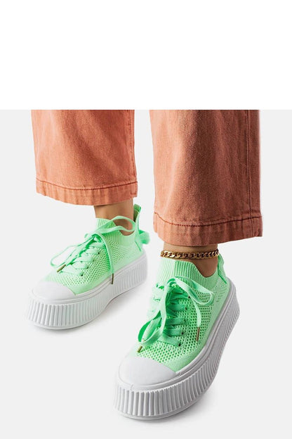 Solea green sneakers for women displayed in a chic environment, ideal for casual summer outings with a sophisticated twist.
