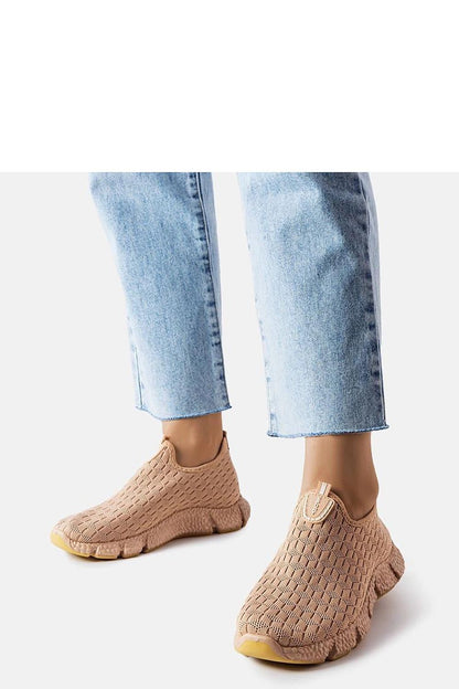 Solea Beige Slip-On Sports Sneakers on display, featuring a low profile and beige rubber sole for stability during physical activities.