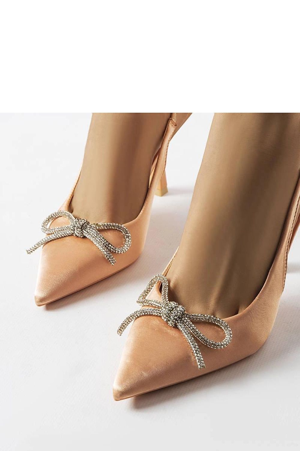 Model wearing Solea Elegant Beige High Heel Pumps with Bow, demonstrating the chic and sophisticated look ideal for summer occasions.
