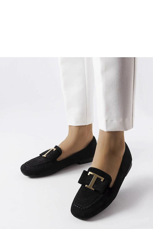 Close-up view of Solea's luxurious black faux suede moccasins, showcasing the elegant stitching and eco-friendly materials for summer outfits.