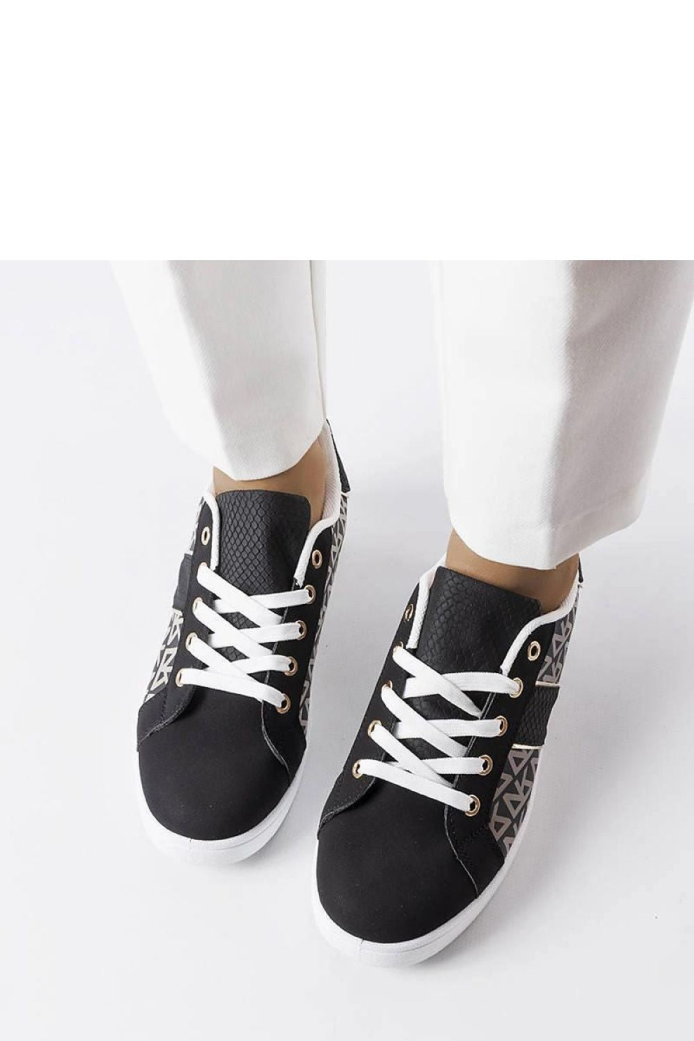 Pair of luxury black Bolduc monogram sneakers for women by Solea, highlighting comfortable lace-up closure and white rubber sole.