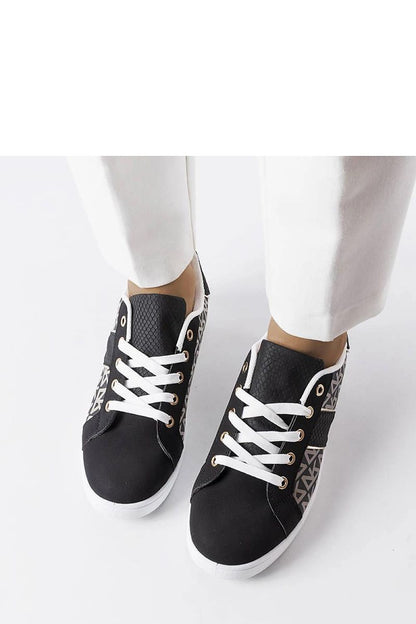 Pair of luxury black Bolduc monogram sneakers for women by Solea, highlighting comfortable lace-up closure and white rubber sole.