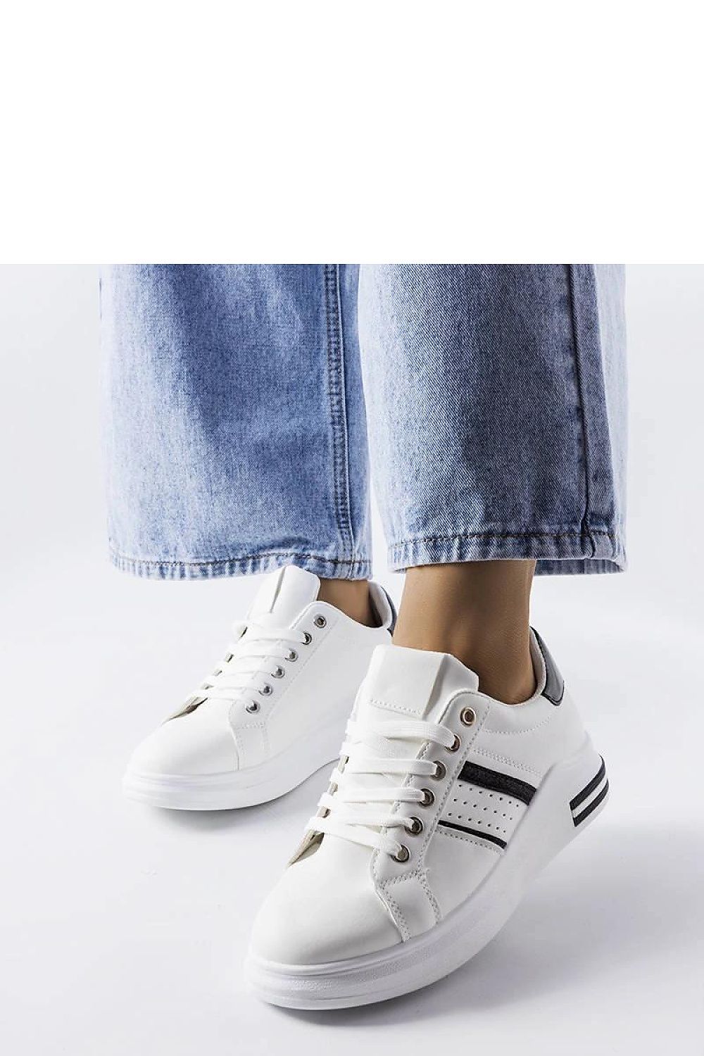 Elegant luxury white platform sneakers by Solea displayed with a casual summer outfit, perfect for casual or evening outings.