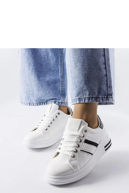 Elegant luxury white platform sneakers by Solea displayed with a casual summer outfit, perfect for casual or evening outings.