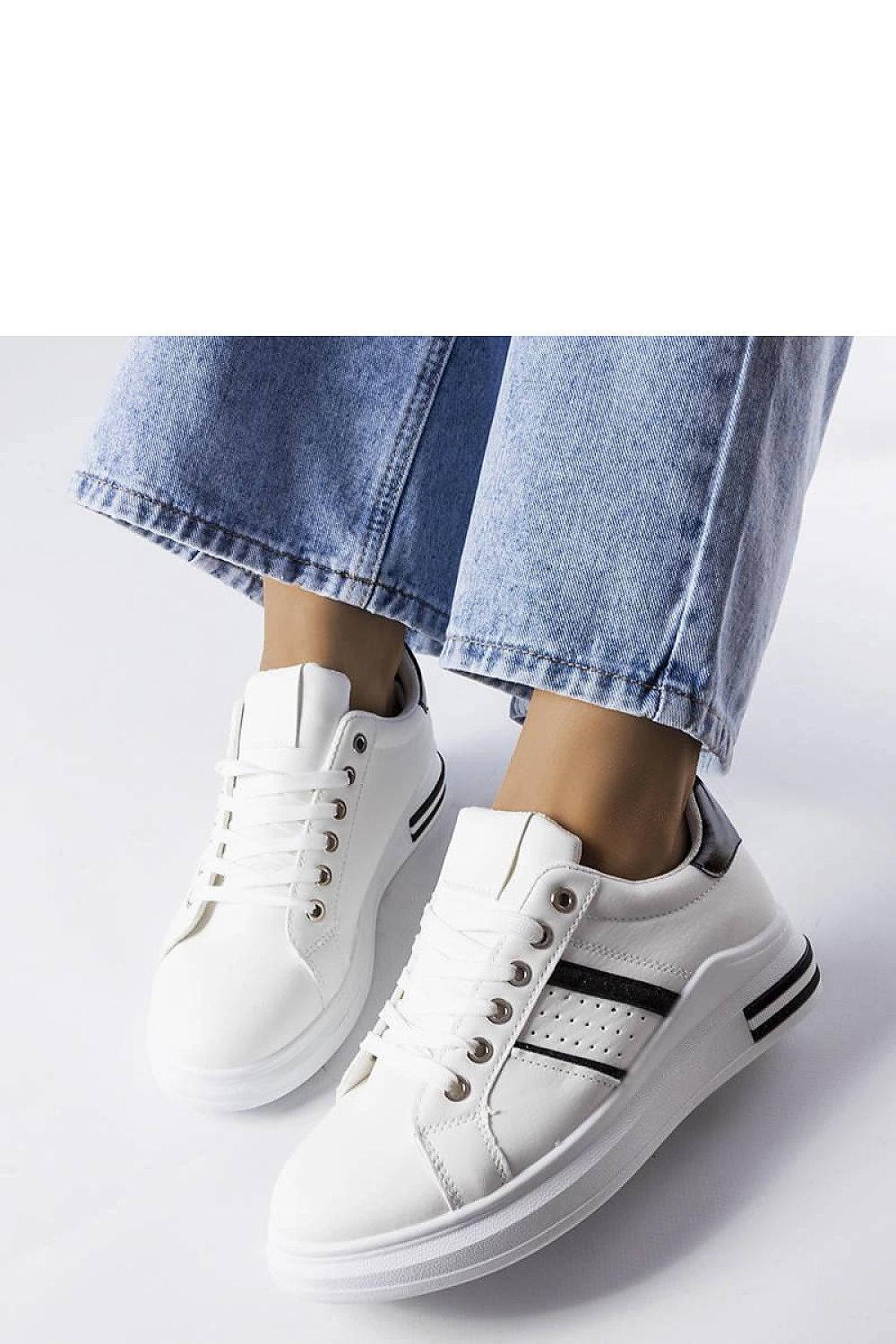Side view of Solea's luxury white platform sneakers featuring a low profile and round toe, embodying chic summer style.