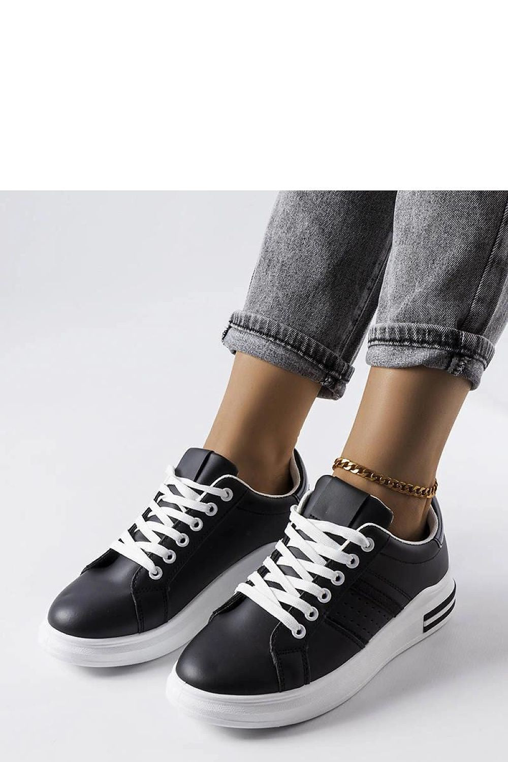 Elegant close-up of Solea's luxury white platform sneakers, featuring durable rubber sole and meticulous stitching for lasting comfort.