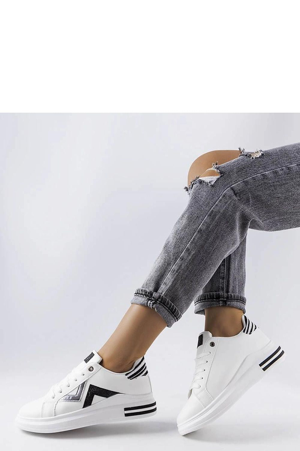 Close-up of Solea women's white and black platform sneakers, highlighting the durable rubber sole and exquisite craftsmanship.