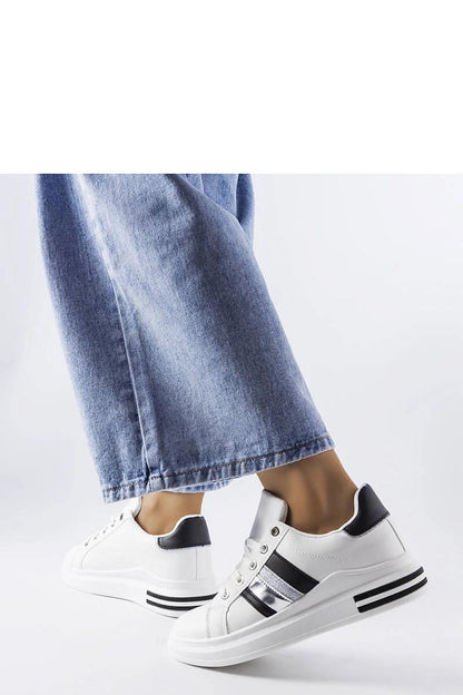 Close-up of Solea platform sneakers featuring sparkling rhinestones and a rubber sole, exemplifying sophistication and comfort for fashionable women.