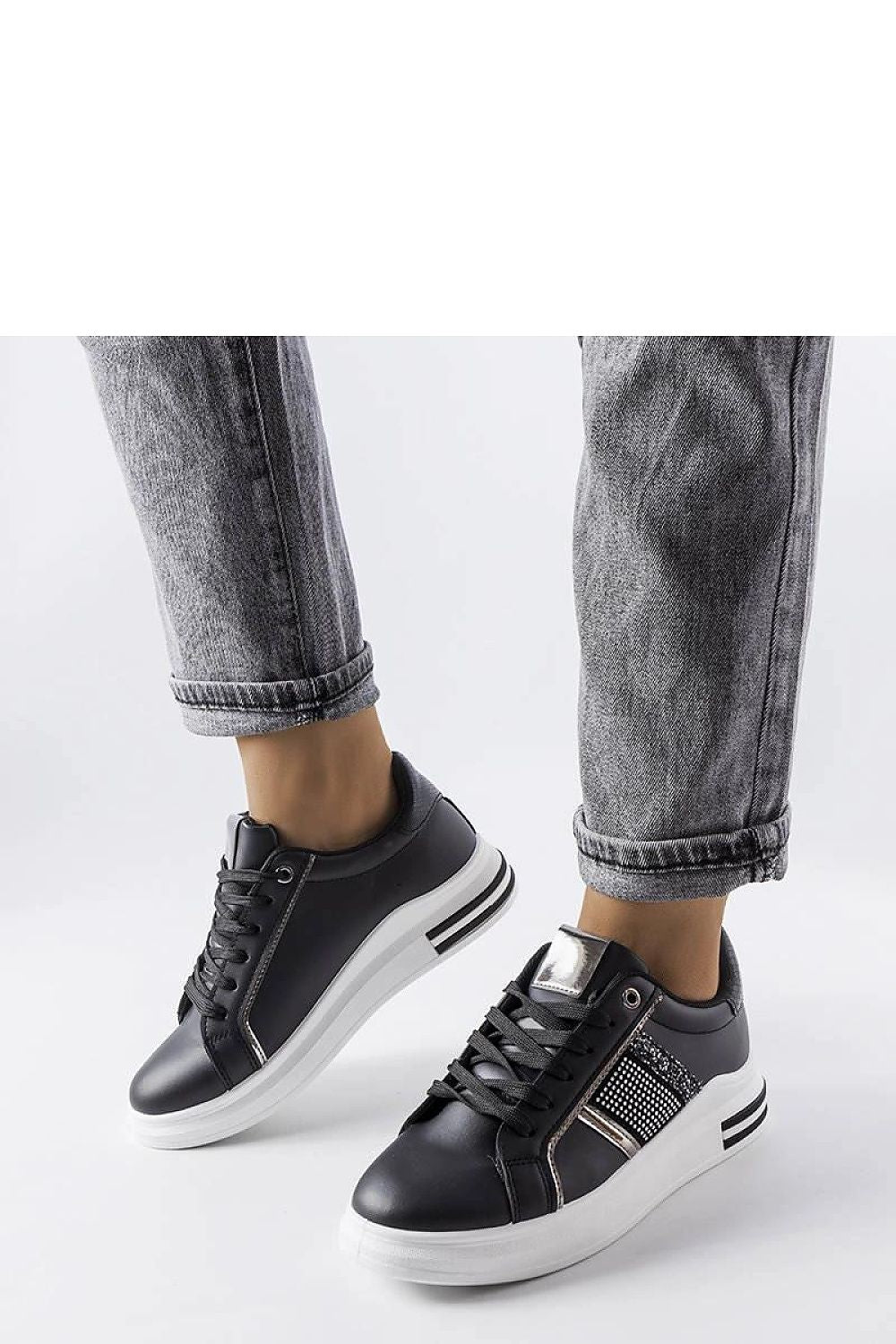 Detail of rhinestone embellishments on Solea's beige Xarles sneakers, combining luxury and everyday comfort.