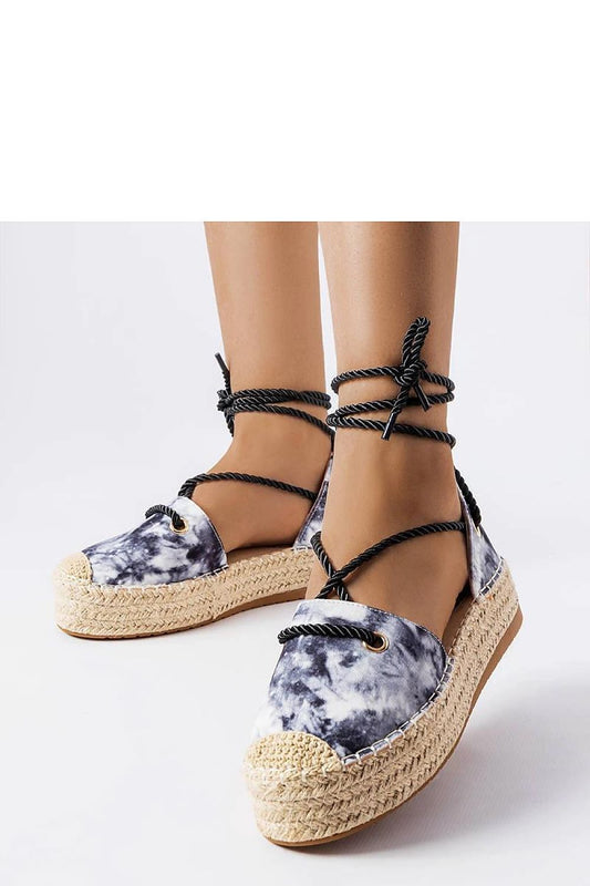 Elegant Solea black platform espadrilles showcasing stylish laced design, featuring a comfortable fabric finish and contrasting beige rubber sole, perfect for summer sophistication.