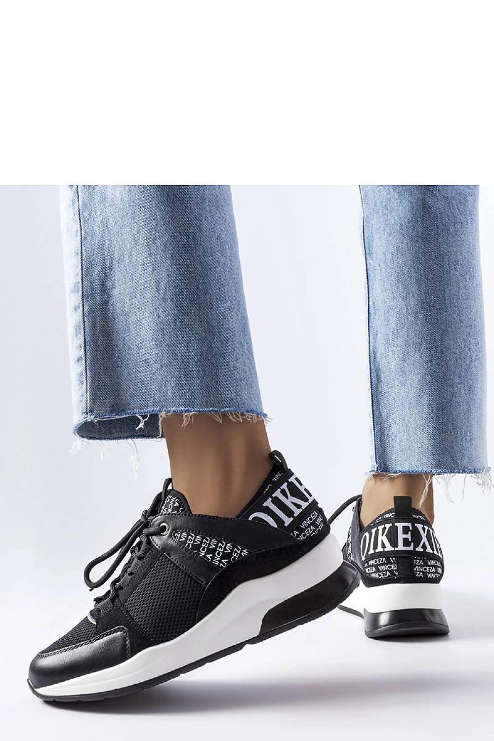 Solea vegan leather sneakers in black and white, showcasing a minimalist platform design, perfect for luxury summer outfits.